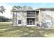 Rear exterior of the townhome with a screened lanai at 144 Reserve Cir # 112, Oviedo, FL 32765