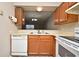 Compact kitchen features a double sink and pass-through to the living area at 144 Reserve Cir # 112, Oviedo, FL 32765