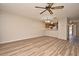 Bright living room features wood-look floors and a ceiling fan at 144 Reserve Cir # 112, Oviedo, FL 32765