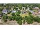 An aerial view showcasing a house with a pool and large lot in a residential area at 1877 Crowley E Cir, Longwood, FL 32779