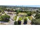 Aerial view of a house with a large yard and a circular driveway at 1877 Crowley E Cir, Longwood, FL 32779