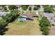 Aerial view of a house with a pool and large backyard at 1877 Crowley E Cir, Longwood, FL 32779