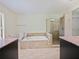 Bathroom with soaking tub and walk-in shower at 1877 Crowley E Cir, Longwood, FL 32779