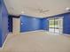 Bedroom with blue walls, pool view, and ceiling fan at 1877 Crowley E Cir, Longwood, FL 32779