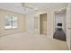 Spacious bedroom with mirrored closet and access to other rooms at 1877 Crowley E Cir, Longwood, FL 32779