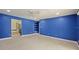 Blue bedroom with ceiling fan and built-in shelving at 1877 Crowley E Cir, Longwood, FL 32779