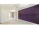 Bedroom with purple accent wall and ceiling fan at 1877 Crowley E Cir, Longwood, FL 32779