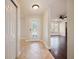 Inviting entryway with tile floors and glass front door at 1877 Crowley E Cir, Longwood, FL 32779
