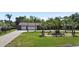 Exterior view of a single-Gathering home with a three-car garage and palm trees at 1877 Crowley E Cir, Longwood, FL 32779