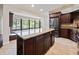 Spacious kitchen with granite island and stainless steel appliances at 1877 Crowley E Cir, Longwood, FL 32779