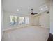 Bright living room with large windows and high ceilings at 1877 Crowley E Cir, Longwood, FL 32779