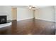Living room with hardwood floors and corner fireplace at 1877 Crowley E Cir, Longwood, FL 32779