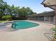 Refreshing kidney-shaped pool with spa, surrounded by lush landscaping at 1877 Crowley E Cir, Longwood, FL 32779