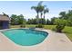 Inviting kidney-shaped pool with a spa, surrounded by a large patio at 1877 Crowley E Cir, Longwood, FL 32779