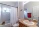 Cozy bathroom with a shower-tub combo, single vanity, and ample lighting at 2048 Gloria Oak Ct, Orlando, FL 32820