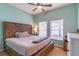 Bedroom with wood platform bed and window at 2048 Gloria Oak Ct, Orlando, FL 32820