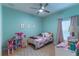bedroom with twin bed, toys, and cheerful decor at 2048 Gloria Oak Ct, Orlando, FL 32820