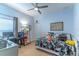 Bedroom with twin bed, desk, and dinosaur decor at 2048 Gloria Oak Ct, Orlando, FL 32820