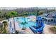 This stunning community pool includes a slide, splash pad, and plenty of seating for lounging in the sun at 2048 Gloria Oak Ct, Orlando, FL 32820