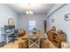 This dining room features rustic décor and a view to the adjacent workspace, bringing comfort to productivity at 2048 Gloria Oak Ct, Orlando, FL 32820