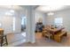 The dining room and entryway showcase an open floor plan with a rustic dining table, seating, and decor at 2048 Gloria Oak Ct, Orlando, FL 32820