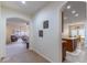 This hallway leads to an open floor plan with a living room and kitchen that blend style and functionality at 2048 Gloria Oak Ct, Orlando, FL 32820