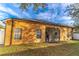 Back exterior view of house with screened porch at 2048 Gloria Oak Ct, Orlando, FL 32820