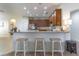 Kitchen boasts wood cabinets, stainless steel appliances, and a breakfast bar at 2048 Gloria Oak Ct, Orlando, FL 32820