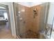 Modern tiled shower with glass door, rainfall showerhead, and built-in niche at 2048 Gloria Oak Ct, Orlando, FL 32820