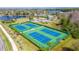 Aerial view of well-maintained community tennis courts, perfect for recreational play at 2048 Gloria Oak Ct, Orlando, FL 32820