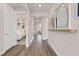 Bright hallway with hardwood floors, leading to bedrooms and living spaces at 2066 Branched Oak Rd, St Cloud, FL 34771