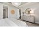 Main bedroom with dresser and access to bathroom at 2066 Branched Oak Rd, St Cloud, FL 34771