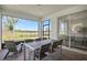 Covered patio with seating and view of backyard and interior dining area at 2066 Branched Oak Rd, St Cloud, FL 34771