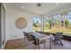 Screened patio with table and chairs, offering backyard views at 2066 Branched Oak Rd, St Cloud, FL 34771