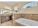 Bathroom with soaking tub and double sinks at 245 Viola Dr, Auburndale, FL 33823