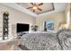 Spacious bedroom with large bed, TV, and sliding glass door at 245 Viola Dr, Auburndale, FL 33823