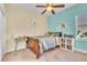 Bedroom with a full bed and lots of books at 245 Viola Dr, Auburndale, FL 33823