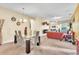 Open concept dining room and living room with a glass dining table at 245 Viola Dr, Auburndale, FL 33823