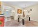 Glass-top dining table with six chairs, located near entryway at 245 Viola Dr, Auburndale, FL 33823