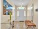 Bright entryway with glass-top console table and mirror at 245 Viola Dr, Auburndale, FL 33823
