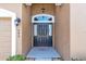 Dark-colored front door with a glass window accent at 245 Viola Dr, Auburndale, FL 33823