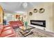 Spacious living room featuring a fireplace and comfortable seating at 245 Viola Dr, Auburndale, FL 33823