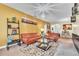Living room with a brown leather sectional sofa and decorative rug at 245 Viola Dr, Auburndale, FL 33823