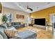 Open living space with sectional sofa and large TV at 245 Viola Dr, Auburndale, FL 33823