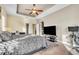 Bright and spacious main bedroom with a king-size bed and TV at 245 Viola Dr, Auburndale, FL 33823