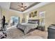 Relaxing main bedroom with a king-size bed and access to the lanai at 245 Viola Dr, Auburndale, FL 33823