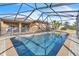 Sparkling, refreshing pool with a screened enclosure for added safety at 245 Viola Dr, Auburndale, FL 33823