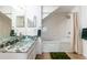 Bright bathroom featuring a unique glass bowl sink atop a granite countertop, alongside a shower at 2622 Lodi Cir # 103, Kissimmee, FL 34746