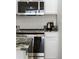 Modern kitchen featuring stainless steel appliances and granite countertops, blending style and function at 2622 Lodi Cir # 103, Kissimmee, FL 34746