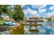 Dock and paddle boats on a pond offer recreational activities in a serene setting at 2622 Lodi Cir # 103, Kissimmee, FL 34746